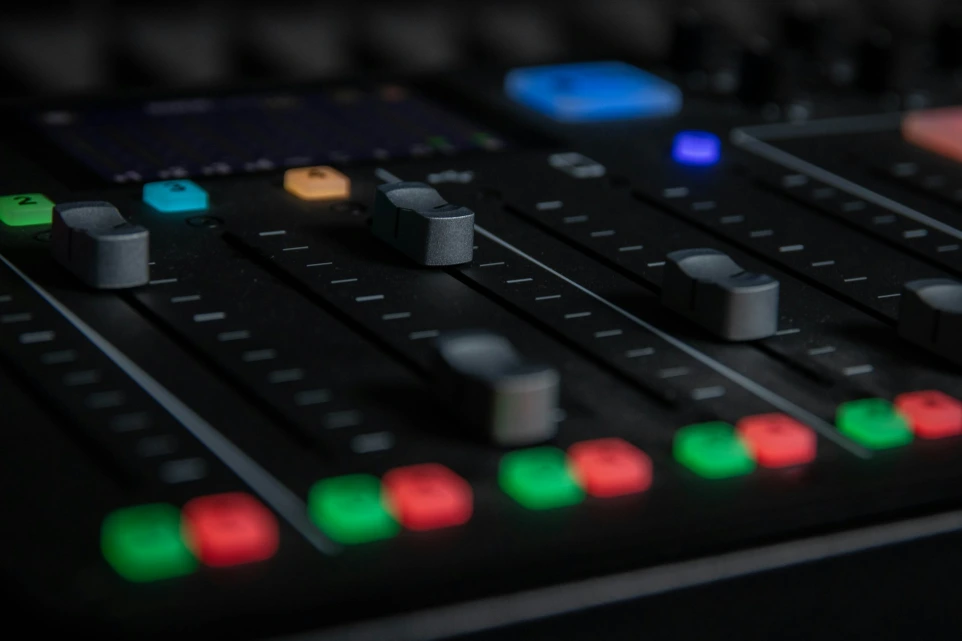 A close-up view of a sound mixing console.